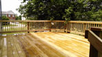We use treated wood for all of our decks