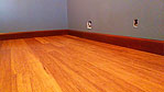 More Bamboo flooring with stained baseboard.