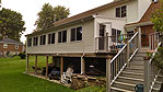 A side view of both the old deck and the room addition we built under the old existing cover porch.