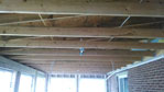 Trusses hold up the roof of the room addition